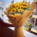 Bó hoa hướng dương 15 bông gói giấy xi măng